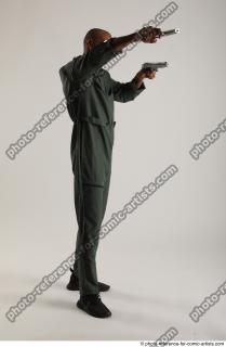 ERIC STANDING POSE WITH GUNS